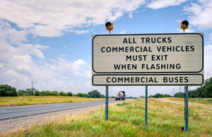semi,truck,weight,station,sign,in,texas,with,traffic,lights