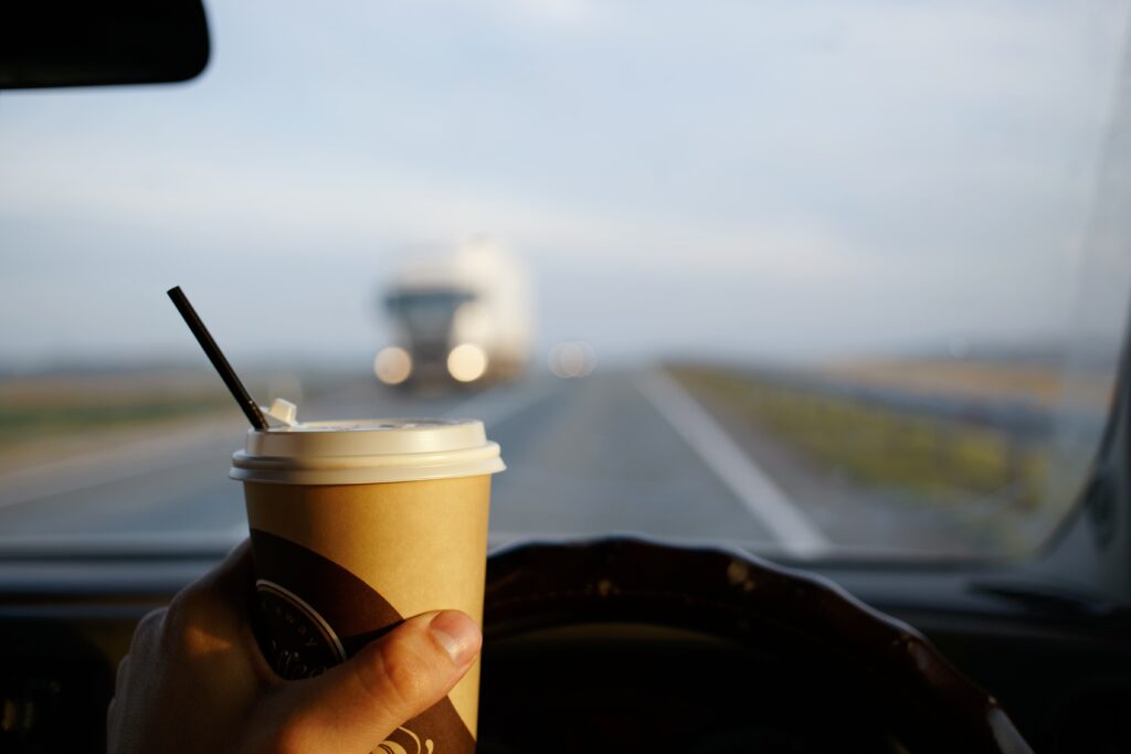 dangerous,driving,on,the,car,with,a,glass,of,coffee